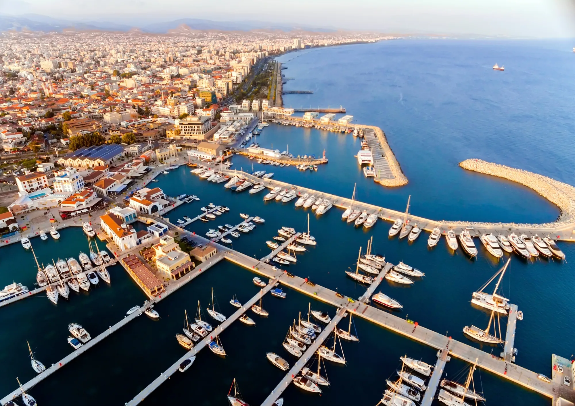 Aerial view of a Mediterranean marina filled with yachts